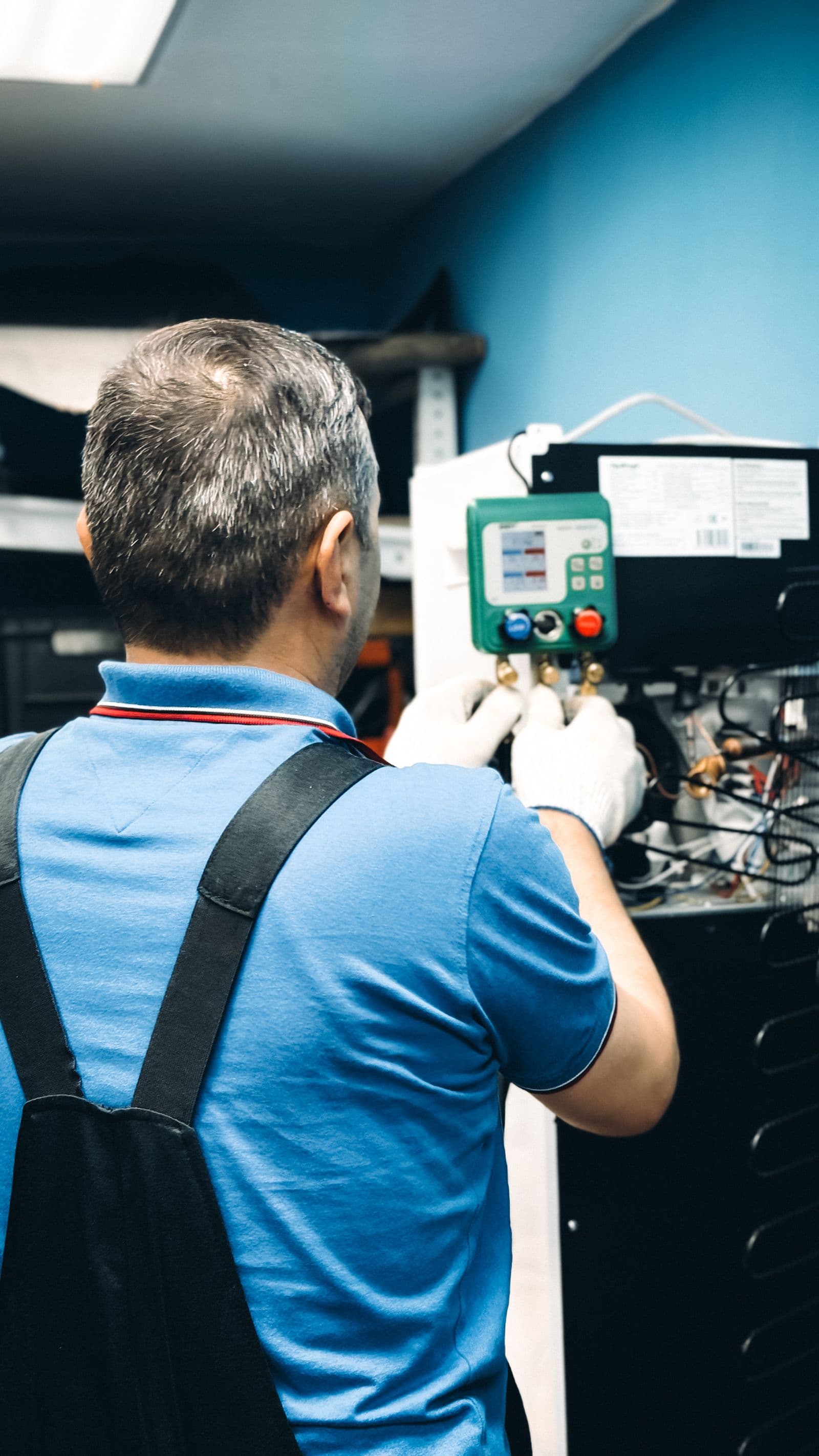 CCC technician testing an AC unit
